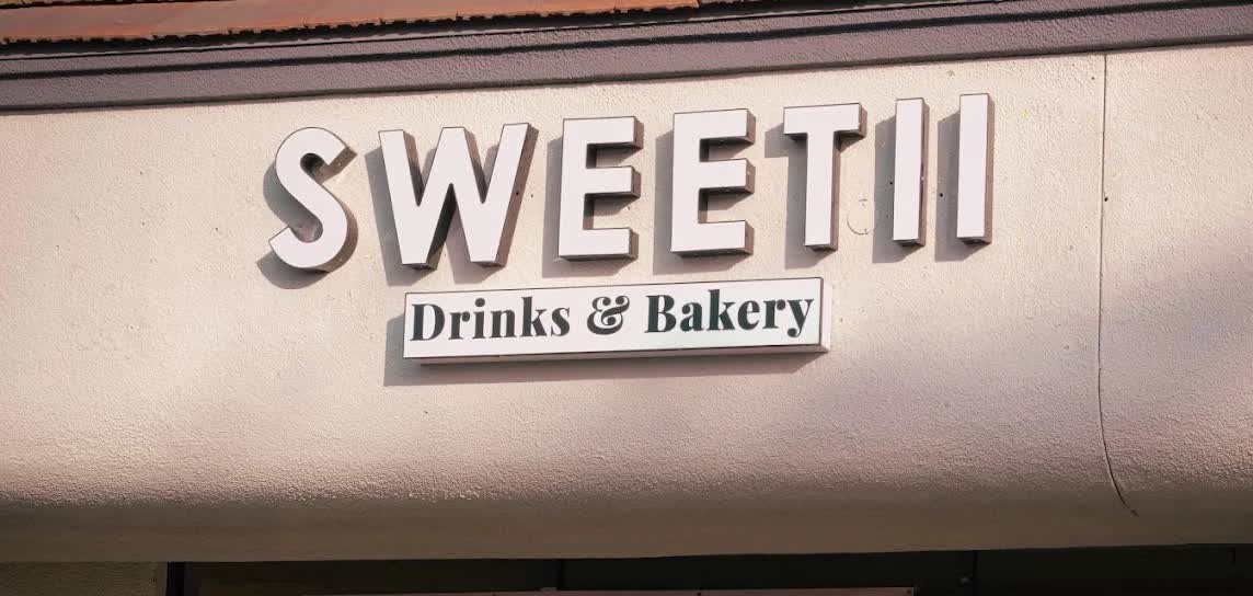 The Sweetii Drinks & Bakery sign above the storefront on Carson Street